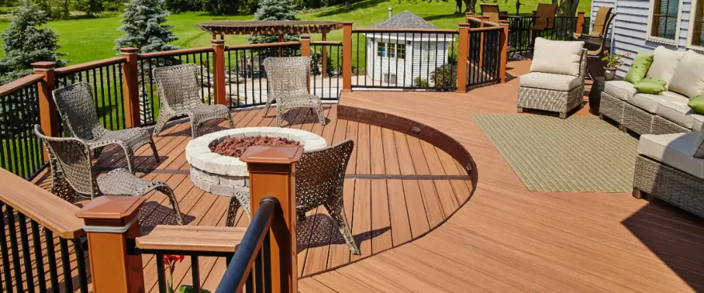 a luxury outdoor deck equipped with a fire pit, seating area with rattan furniture, and a separate lounge area.