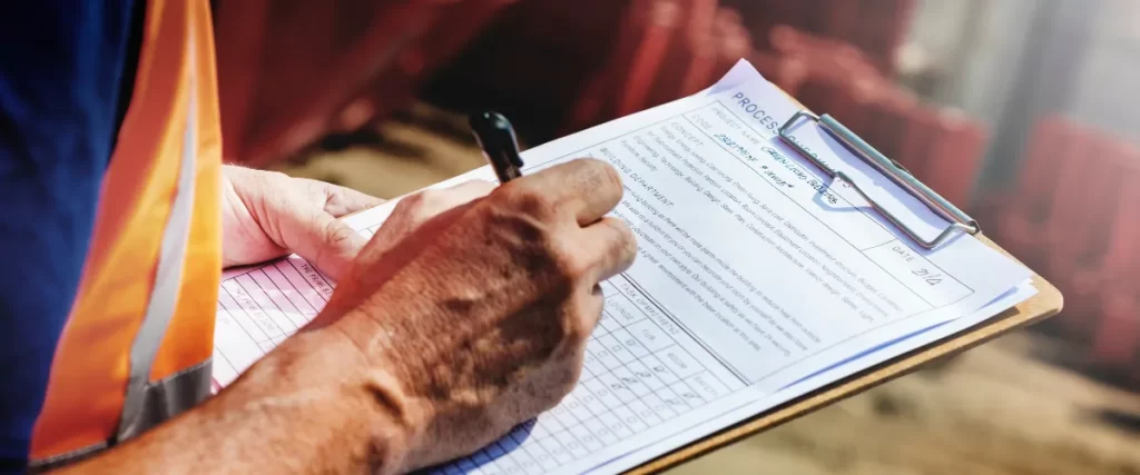 a worker conducting a site inspection or safety audit